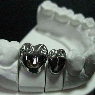 What are the effects of laser process parameters on porosity, surface roughness, and hardness of laser selectively melted dental cobalt-chromium alloys?